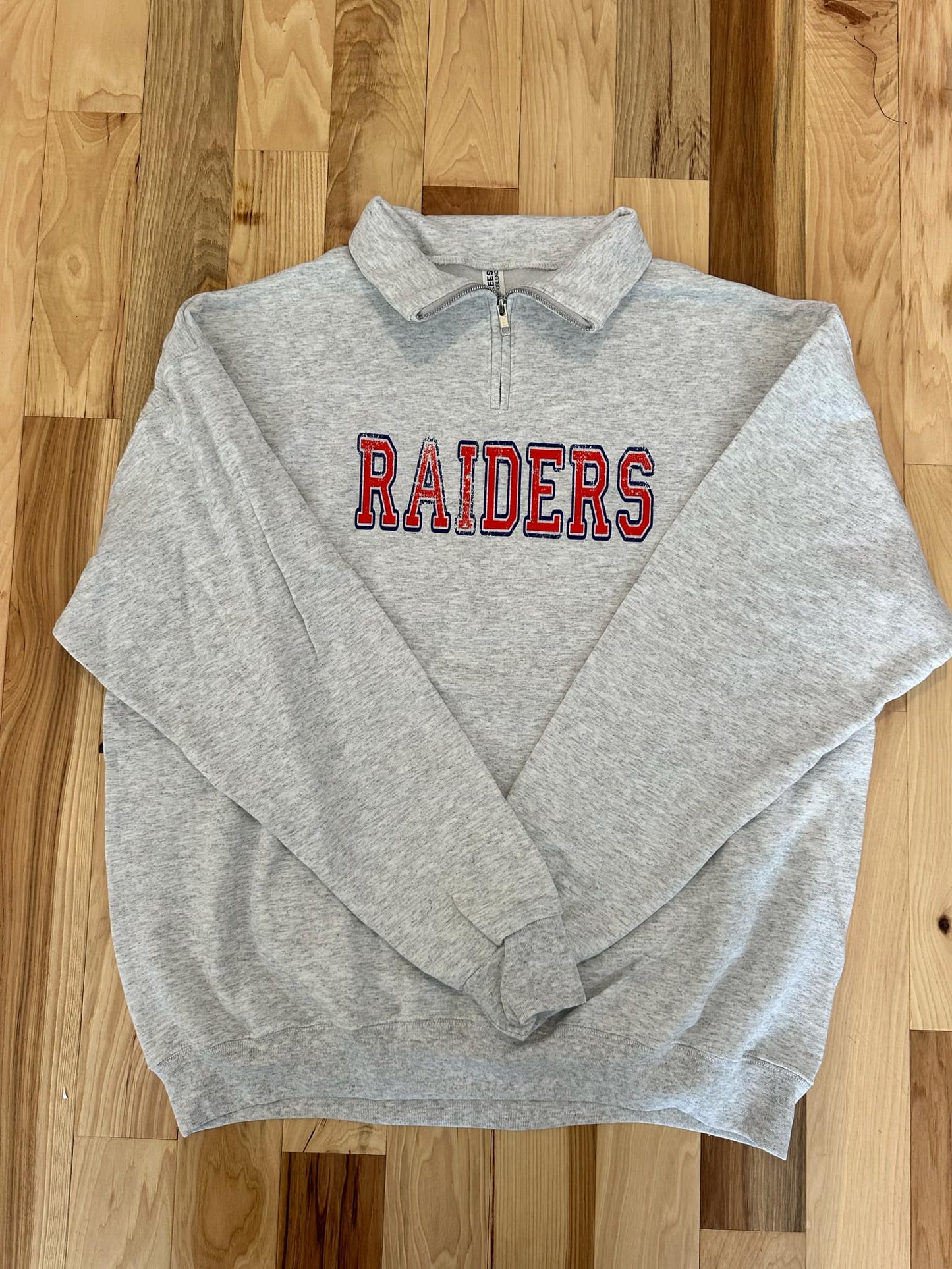 Distressed Raiders Quarter Zip